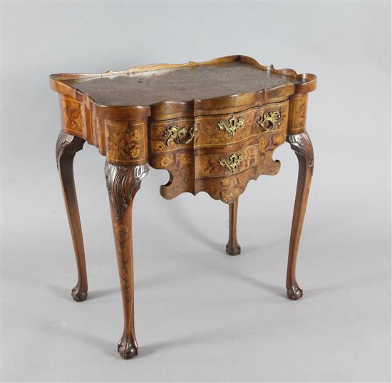 A late 18th century Dutch walnut and marquetry serpentine side table, W.2ft 4in. D.1ft 5in. H.2ft 6in.